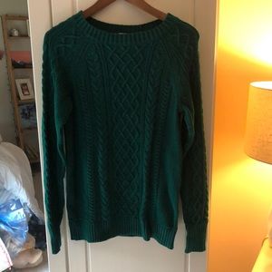 This is an emerald green sweater